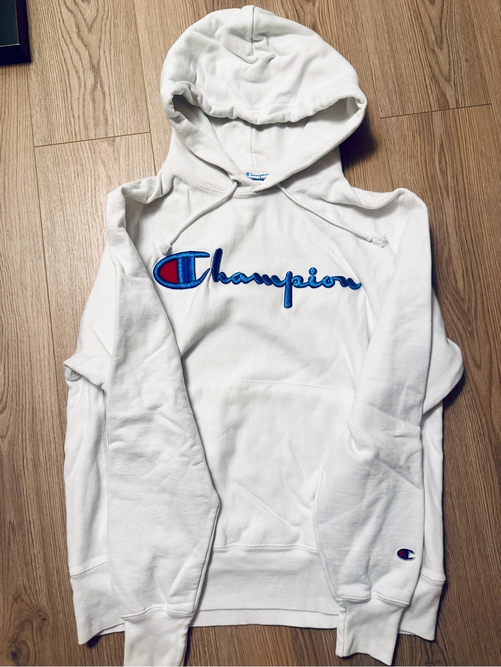 Reverse weave Champion Men’s White Hoodie with Blue & Red Script Logo